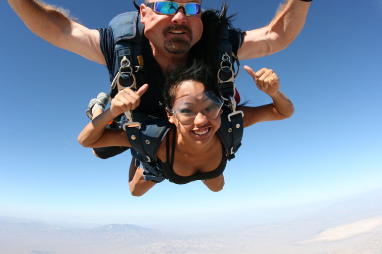 woman jumping out of an airplane